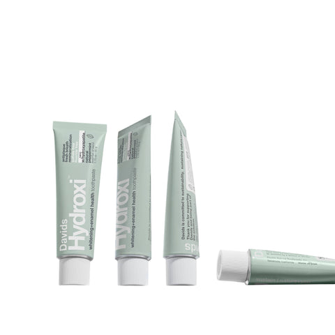 Eden’s Market Davids Hydroxi travel size peppermint toothpaste in recyclable metal tubes for enamel health.