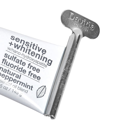 Eden’s Market Davids Health Sciences metal toothpaste tube key attached to a sensitive and whitening toothpaste tube