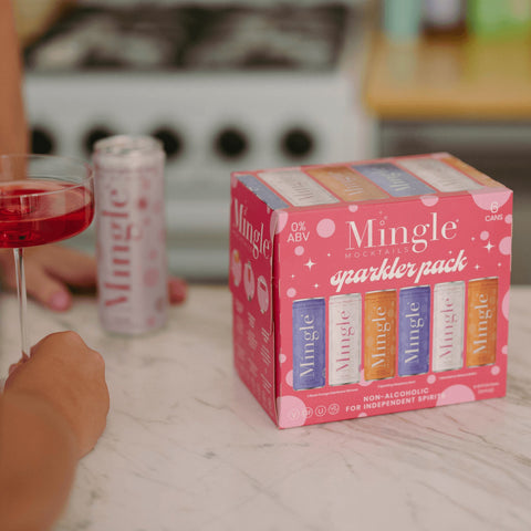 Eden’s Market Mingle Mocktails Sparkler variety pack of six non-alcoholic bubbly drink cans on a kitchen counter.