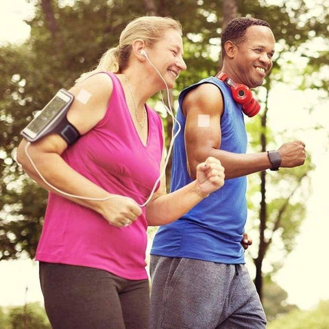 Eden’s Market PatchAid sleep support vitamin patch applied to the arm of a woman jogging outdoors with a partner